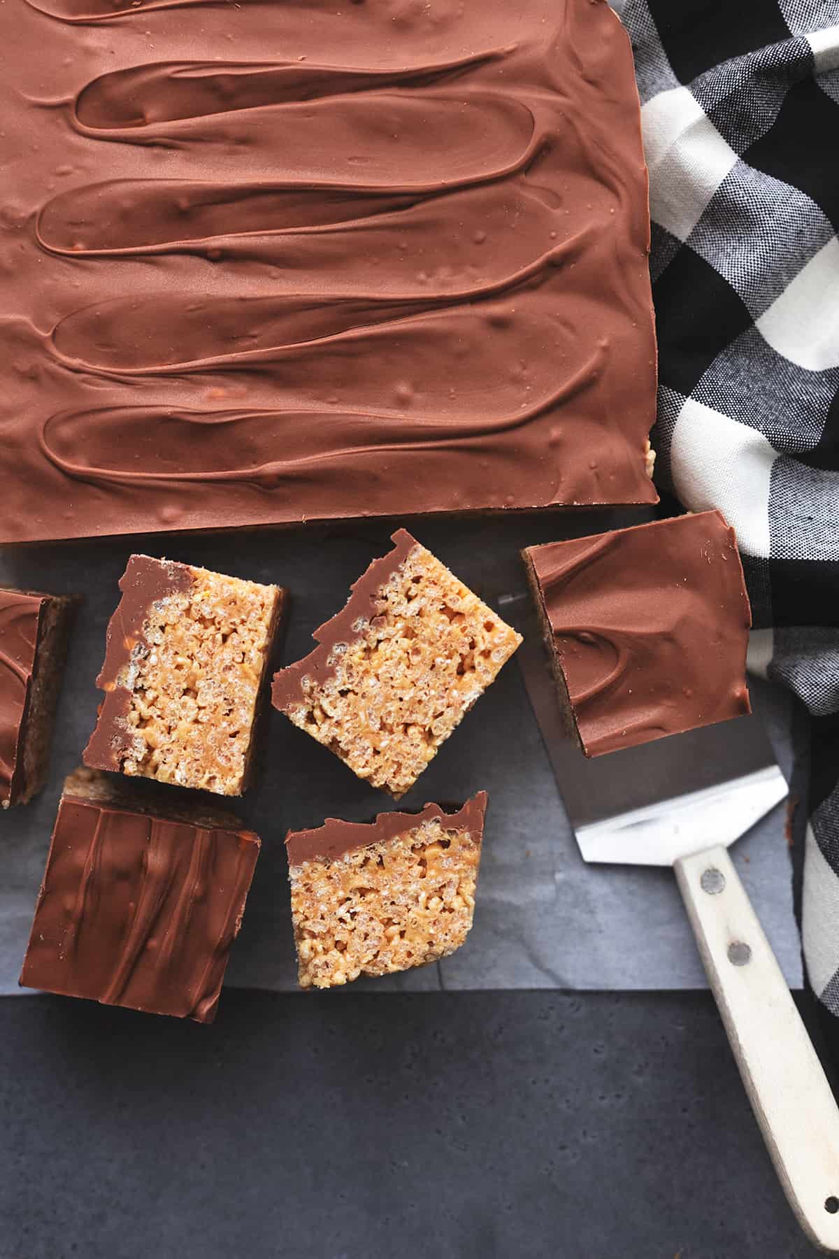 cutting chocolate and rice krispie bars