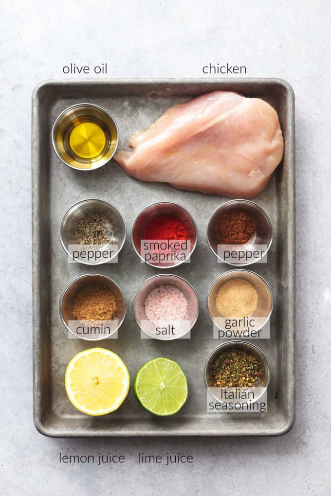 baking sheet with ingredients for baked chicken