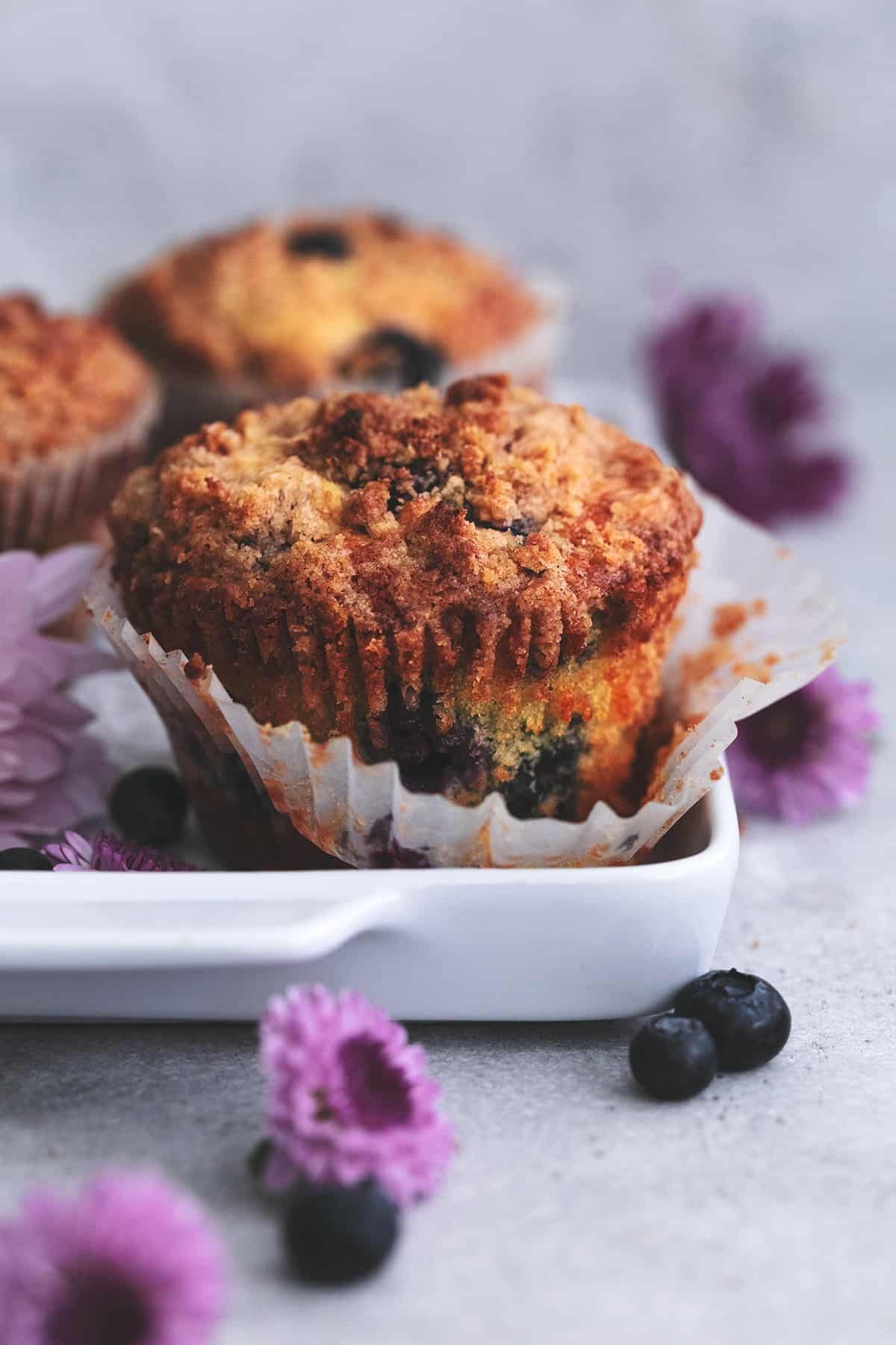 muffin with cinnamon streusel in cupcake wrapper on tray