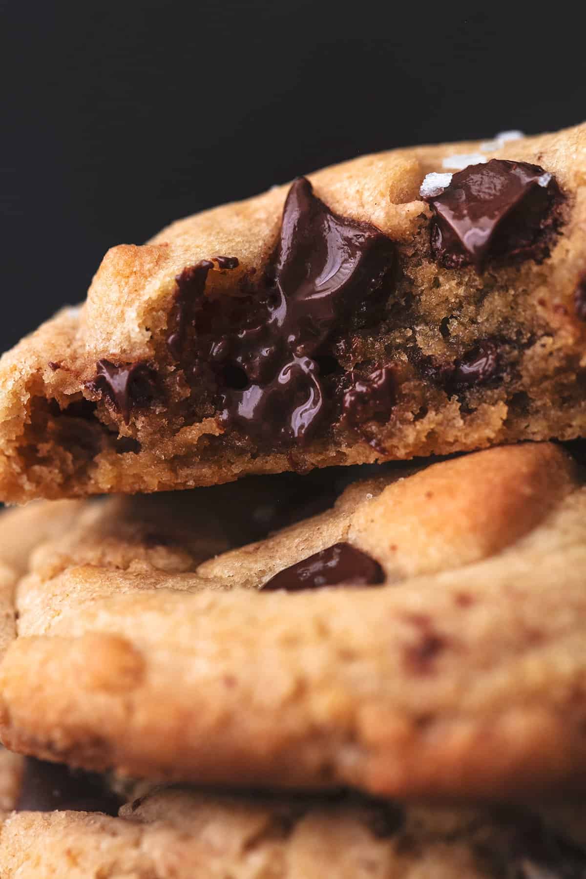 up close view of melty chocolate chips in a cookie