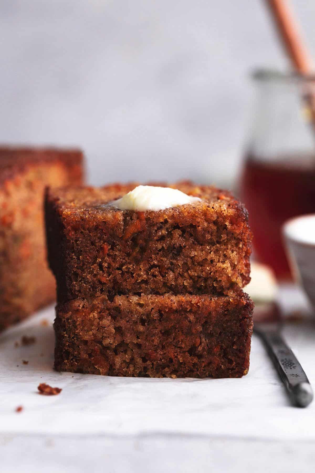 stack of two slices of honeyed carrot loaf on tabletop