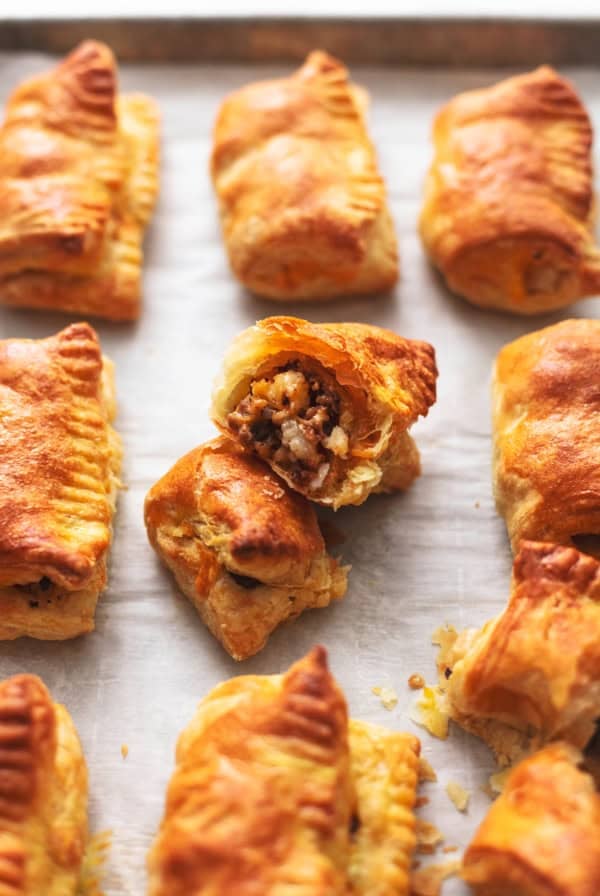 pan of sausage rolls on parchment paper