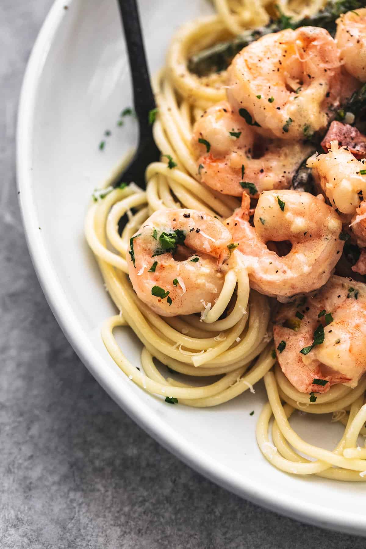 up close garlic shrimp with noodles on fork