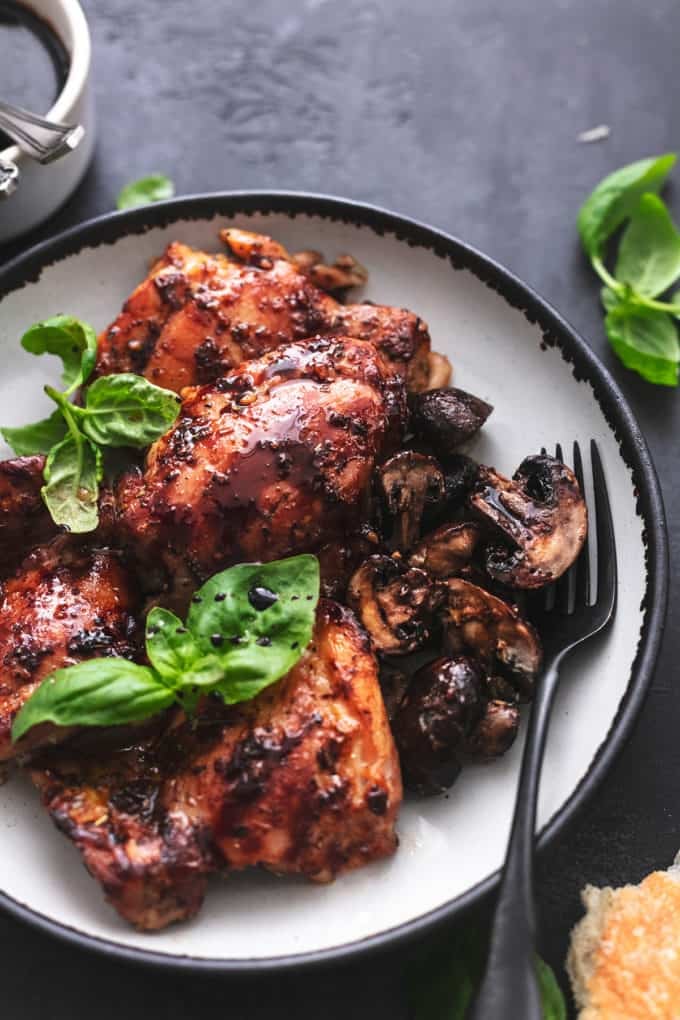 plate of roasted chicken thighs with balsamic glaze