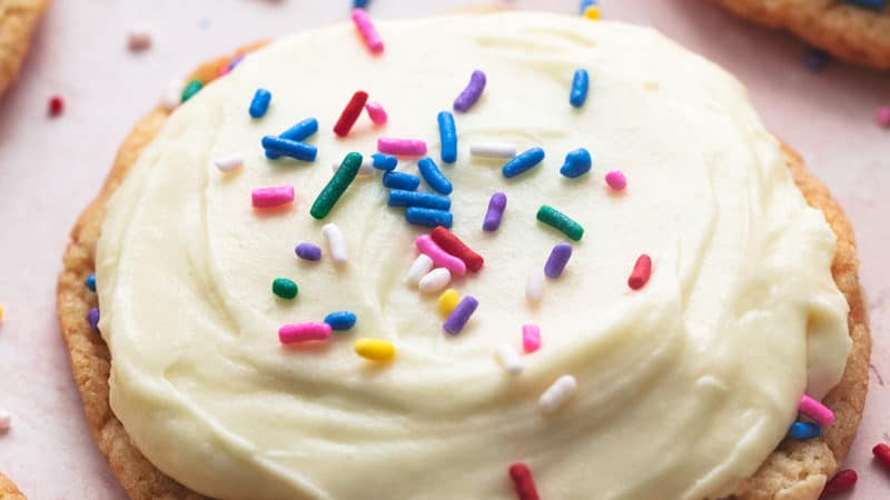 cookie topped with frosting and sprinkles
