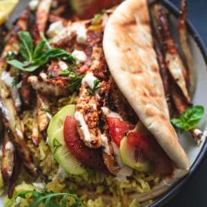 chicken and rice wrapped in pita with cucumber salad