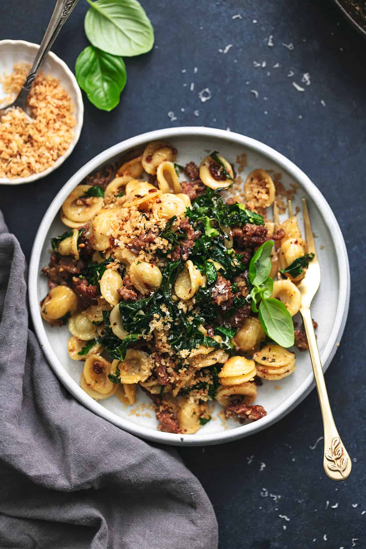 plate of sausage pasta with kale and breadcrumbs