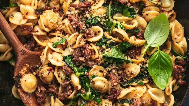 skillet full of orecchiette pasta with sausage