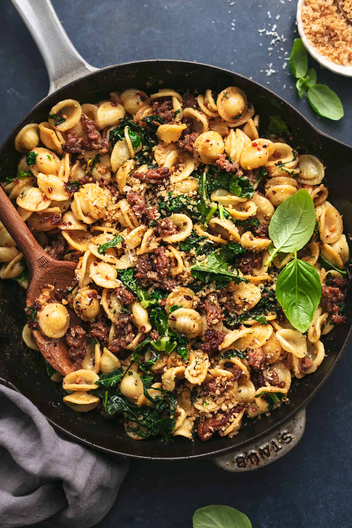 skillet full of orecchiette pasta with sausage