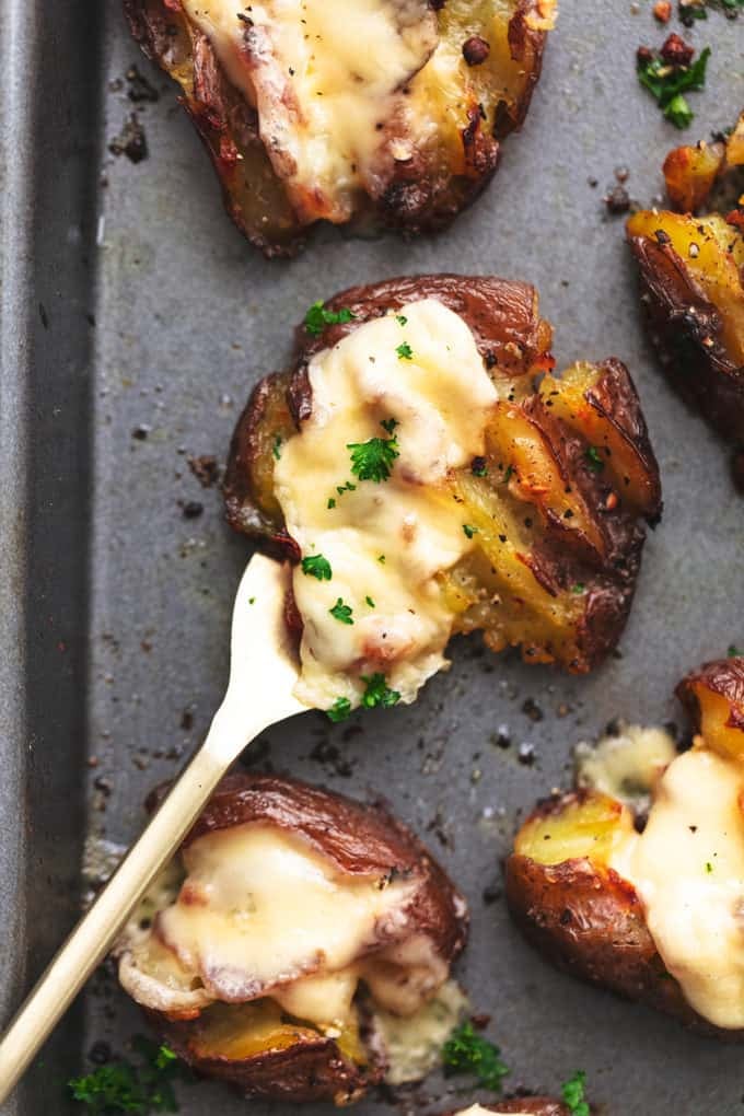 crispy smashed potato on fork on baking pan