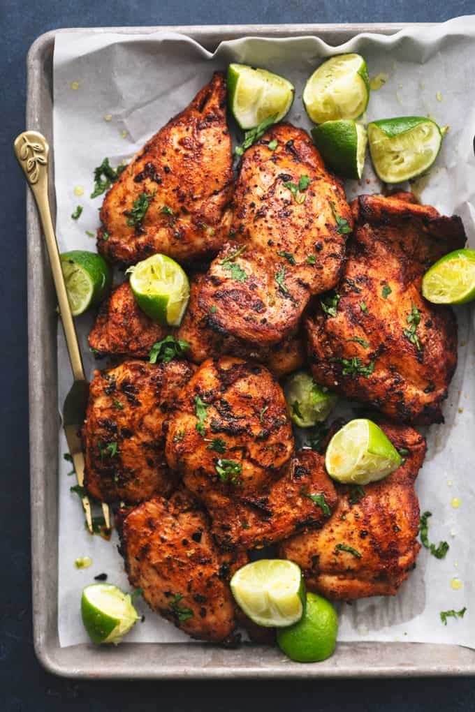 pan of grilled cilantro lime chicken thighs with serving fork 