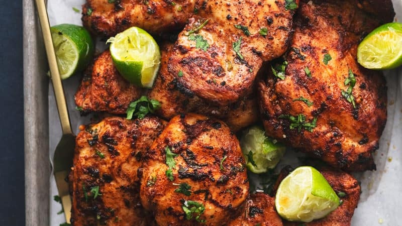 pan of grilled cilantro lime chicken thighs with serving fork