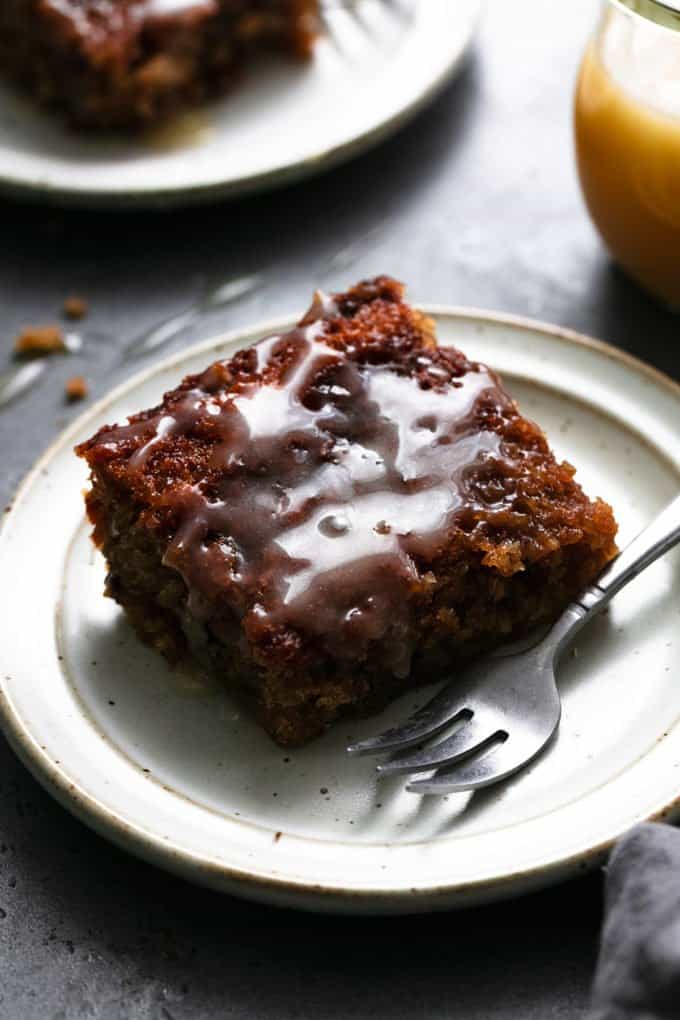 oatmeal cake with vanilla sauce on a plate with a fork