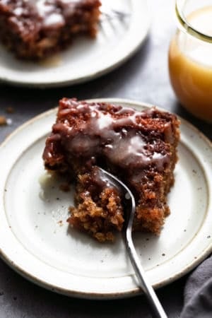 piece of cake on a plate with fork taking a bite out