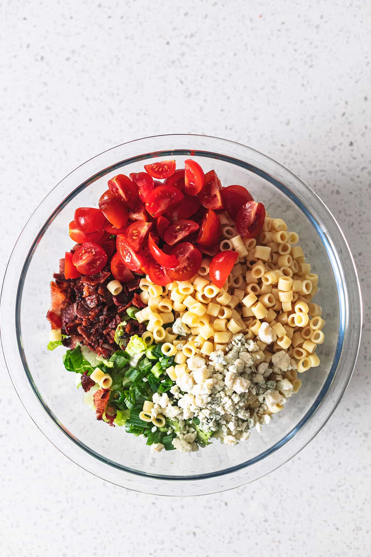 un-tossed ingredients for portillos salad in a bowl