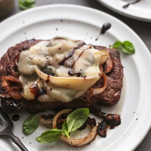 steak with cheese and onions and mushrooms