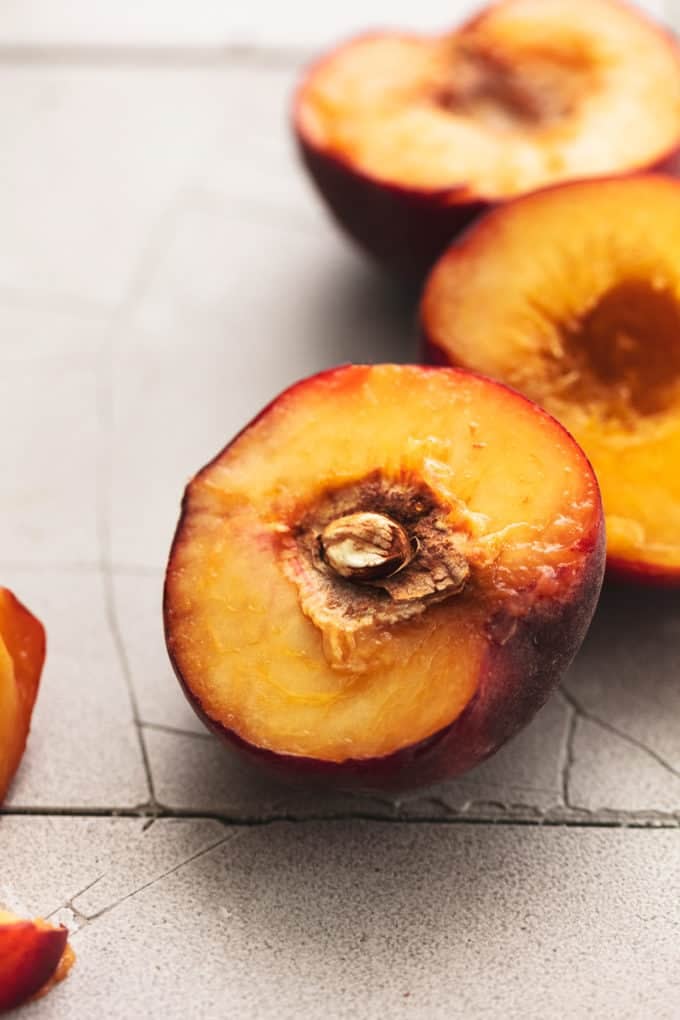 peaches cut open and resting on tabletop