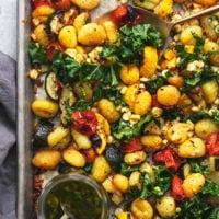 half of a sheet pan with vegetables and gnocchi