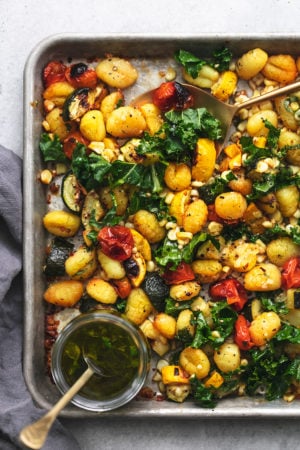 half of a sheet pan with vegetables and gnocchi