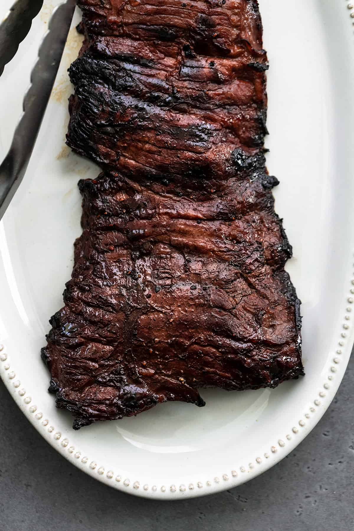 marinated skirt steak on a platter