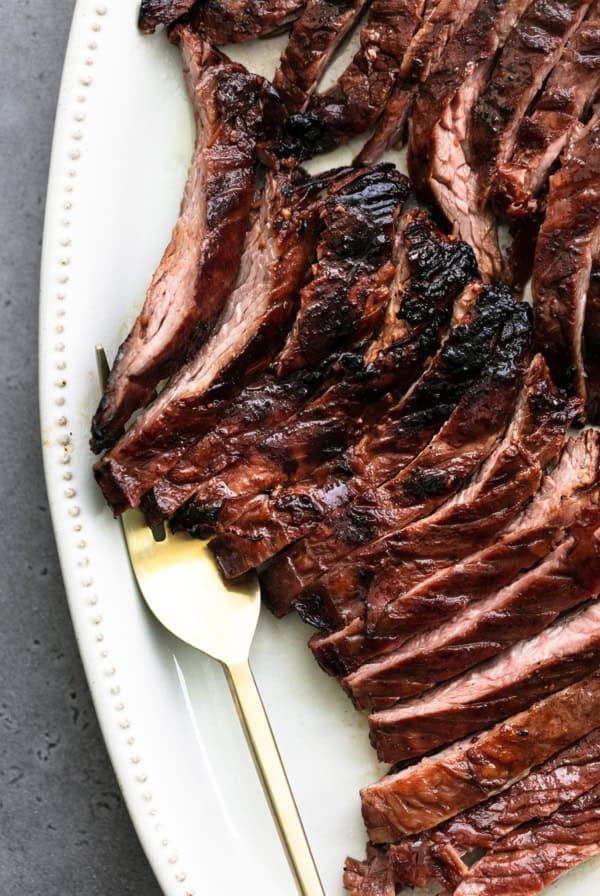 thinly sliced skirt steak with serving fork
