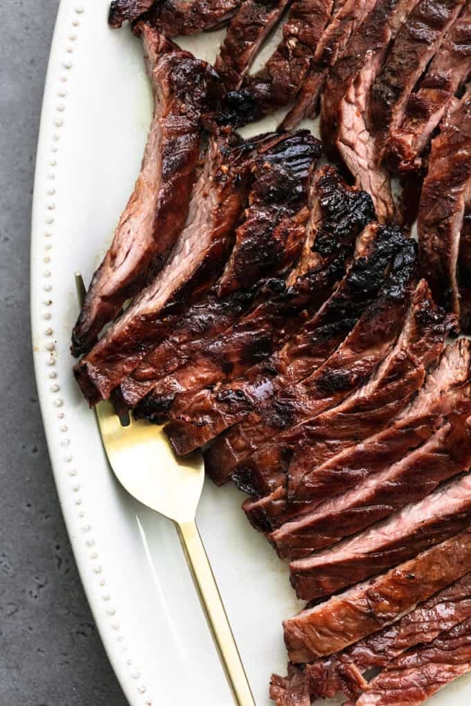 thinly sliced skirt steak with serving fork