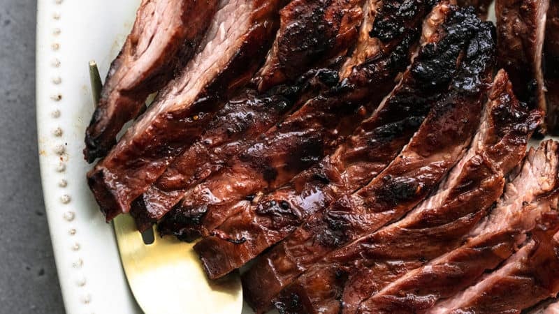 thinly sliced skirt steak with serving fork