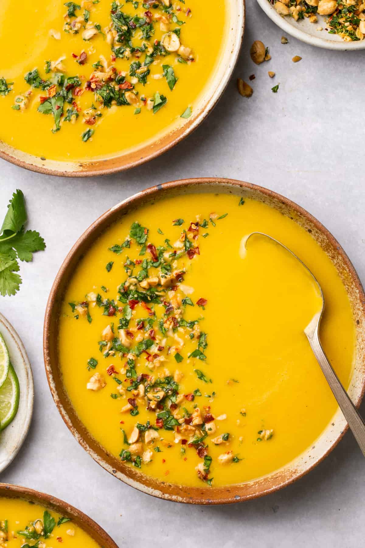 overhead view of two bowls of curried butternut squash soup