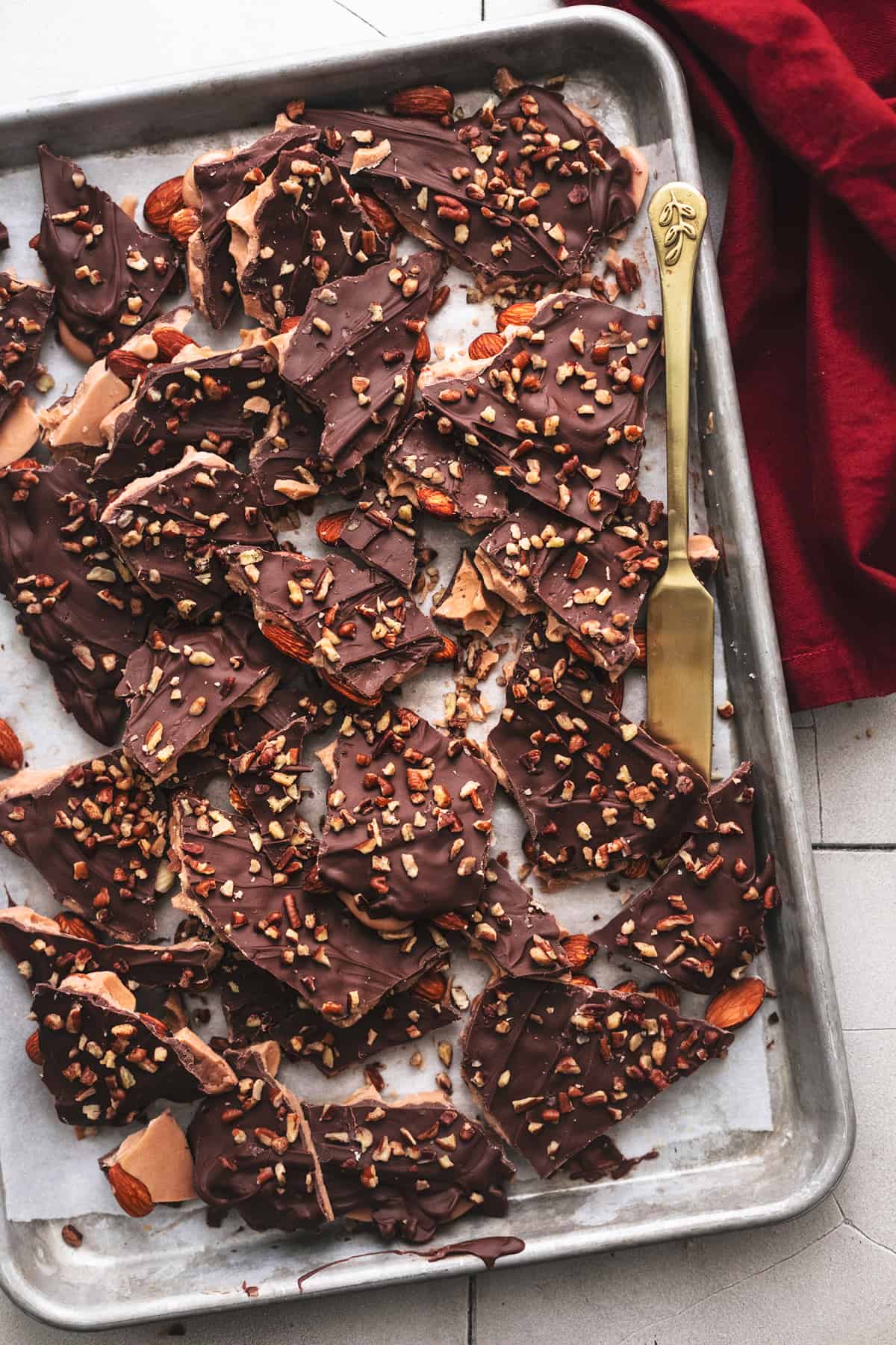 english toffee on a baking sheet with knife and napkin