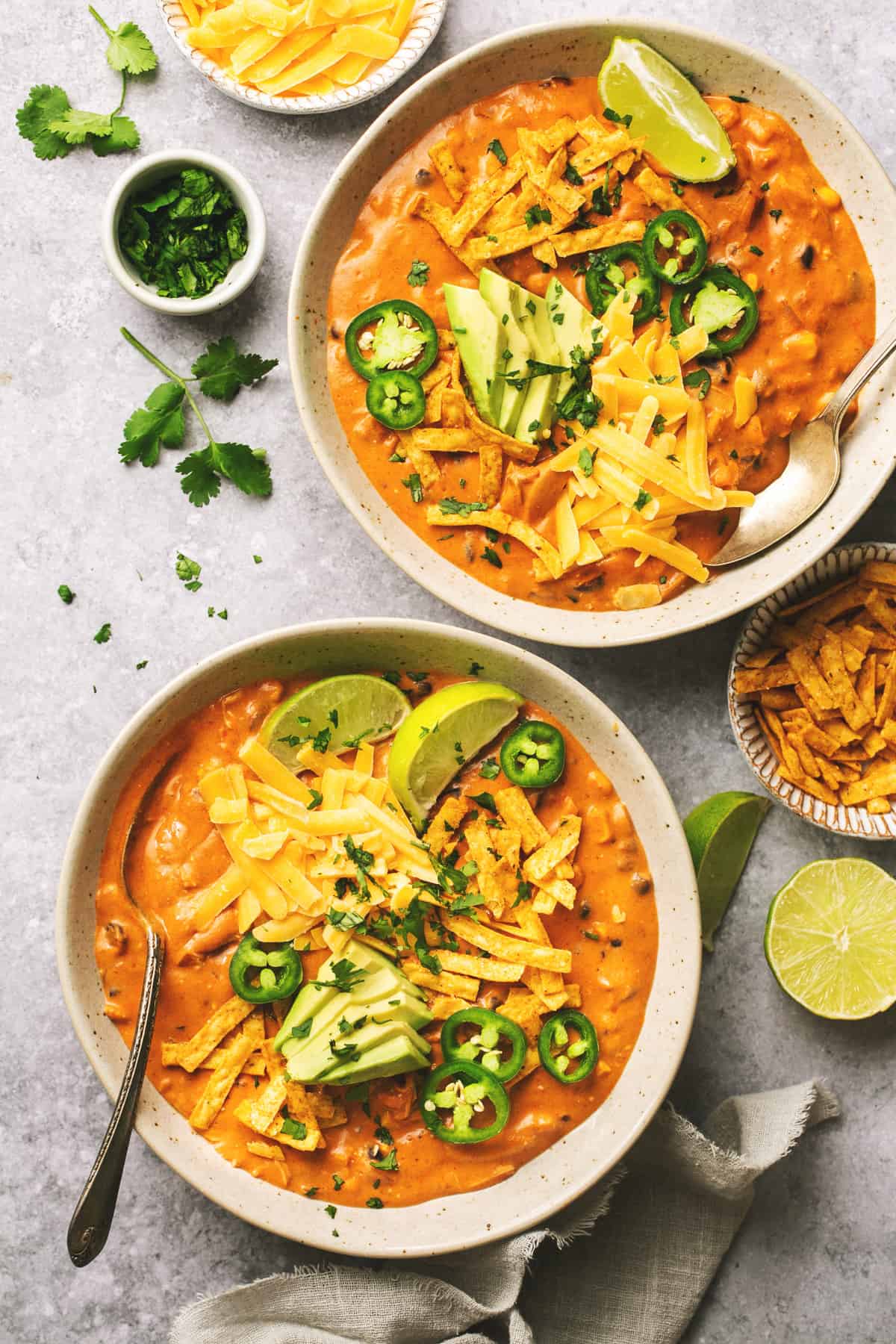 bowls of enchilada soup and bowls of toppings