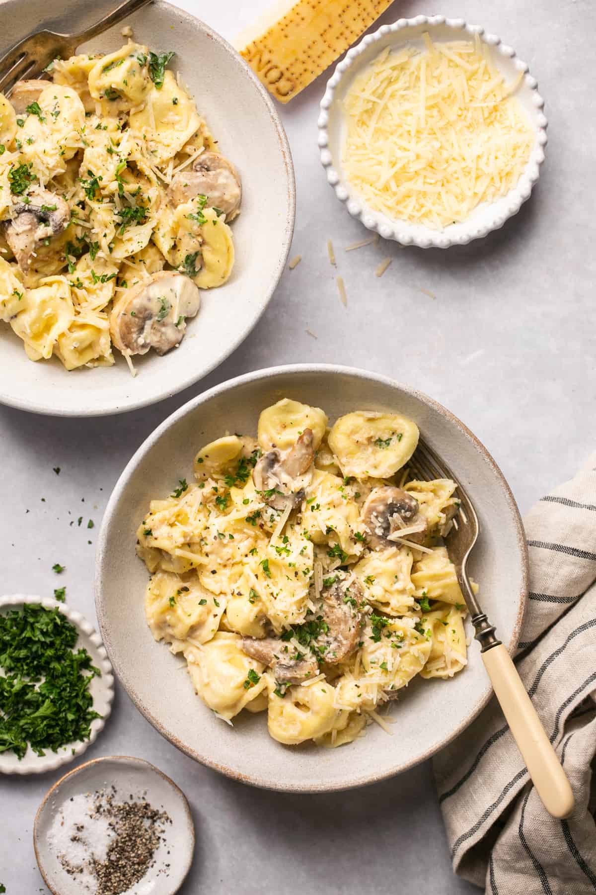 two bowls of pasta with mushrooms