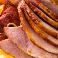 up close slices of glazed baked ham