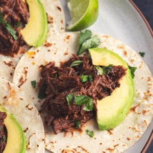 a shredded beef chipotle barbacoa beef taco on a plate