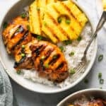 hawaiian huli huli chicken with rice and pineapple on platter