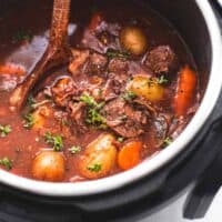 beef bourguignon in an instant pot with serving spoon