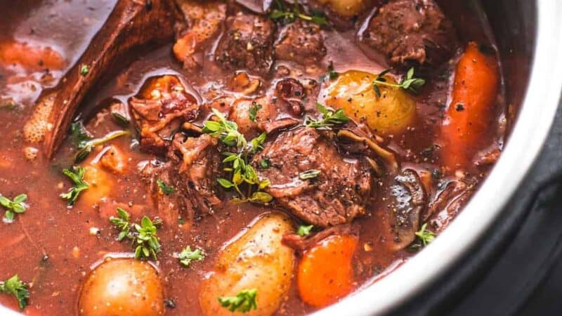 beef bourguignon in an instant pot with serving spoon