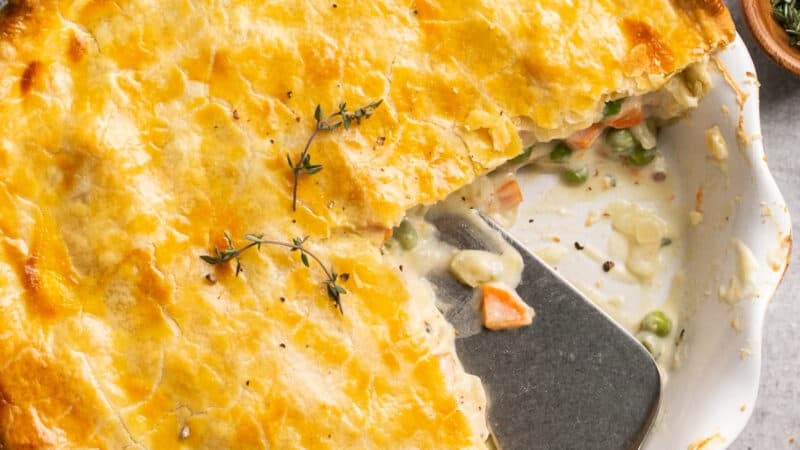 pie server digging into chicken pot pie