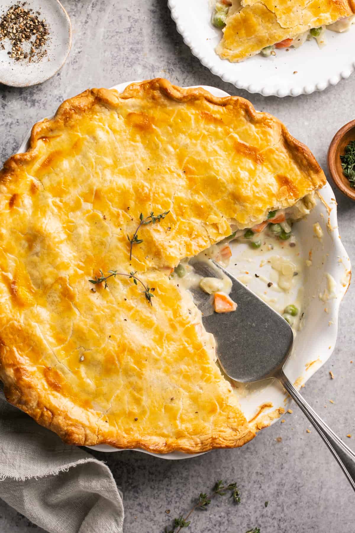 pie server digging into chicken pot pie