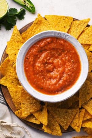 canning salsa in a bowl surrounded by tortilla chips