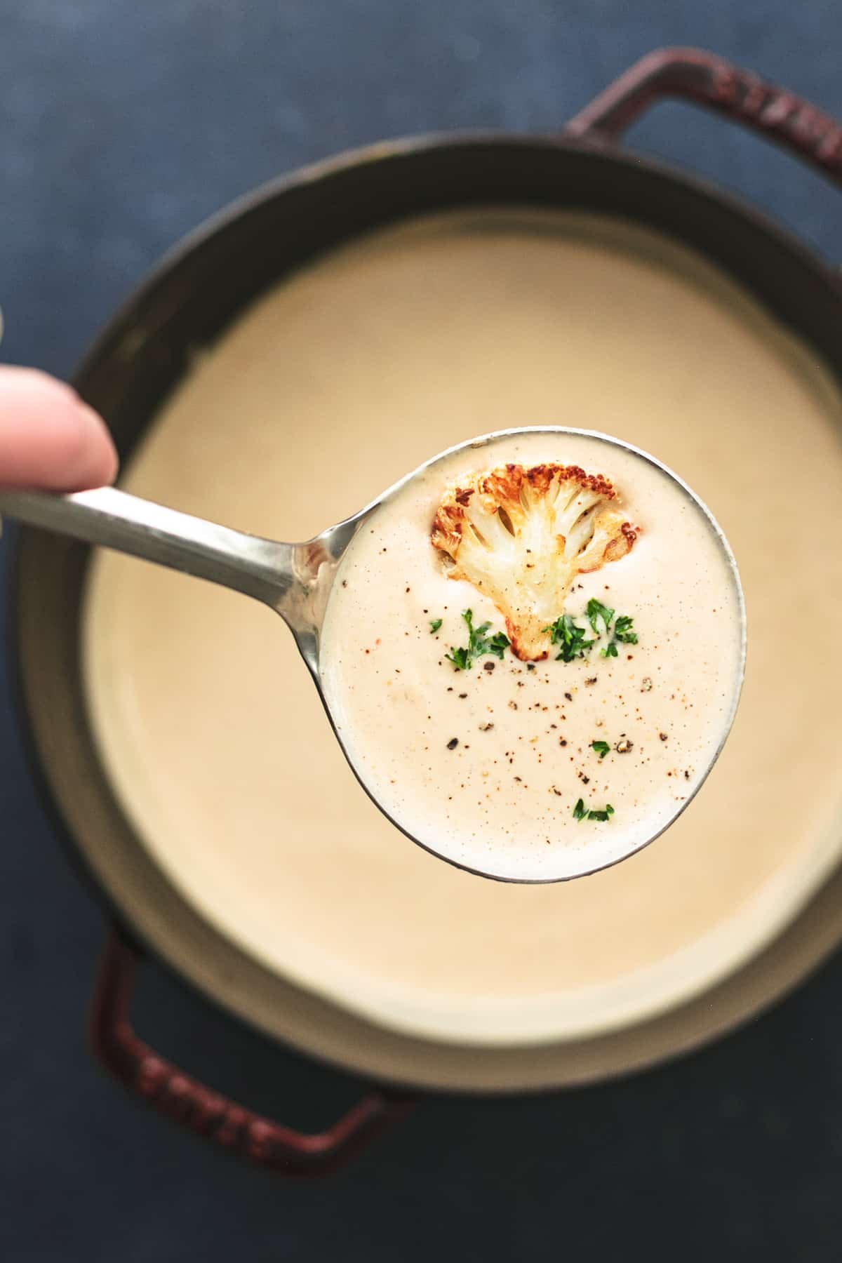 ladle lifting cauliflower soup from pot