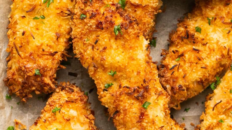 crispy chicken strips with dipping sauce up close