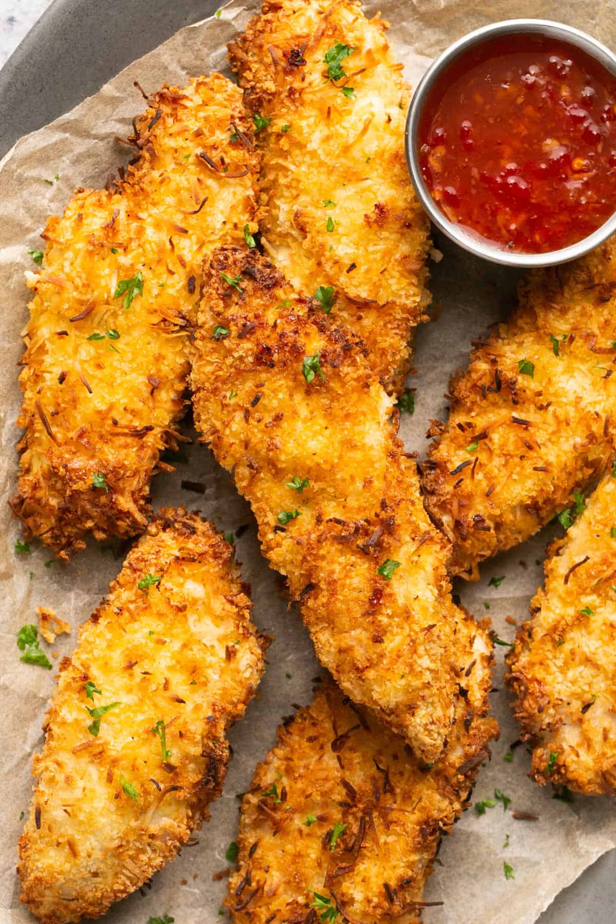 crispy chicken strips with dipping sauce up close