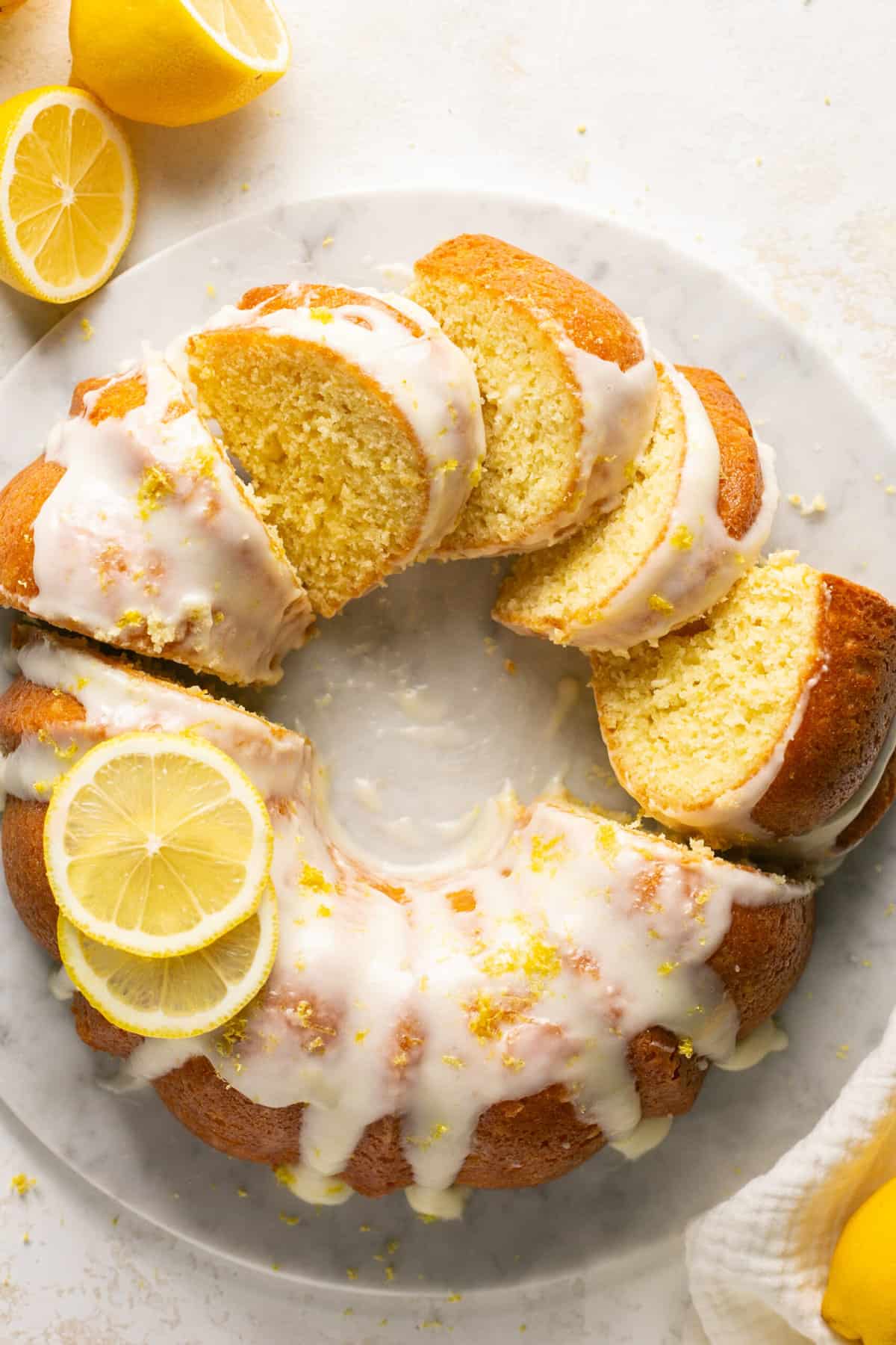 slices of lemon bundt cake on a cake stand