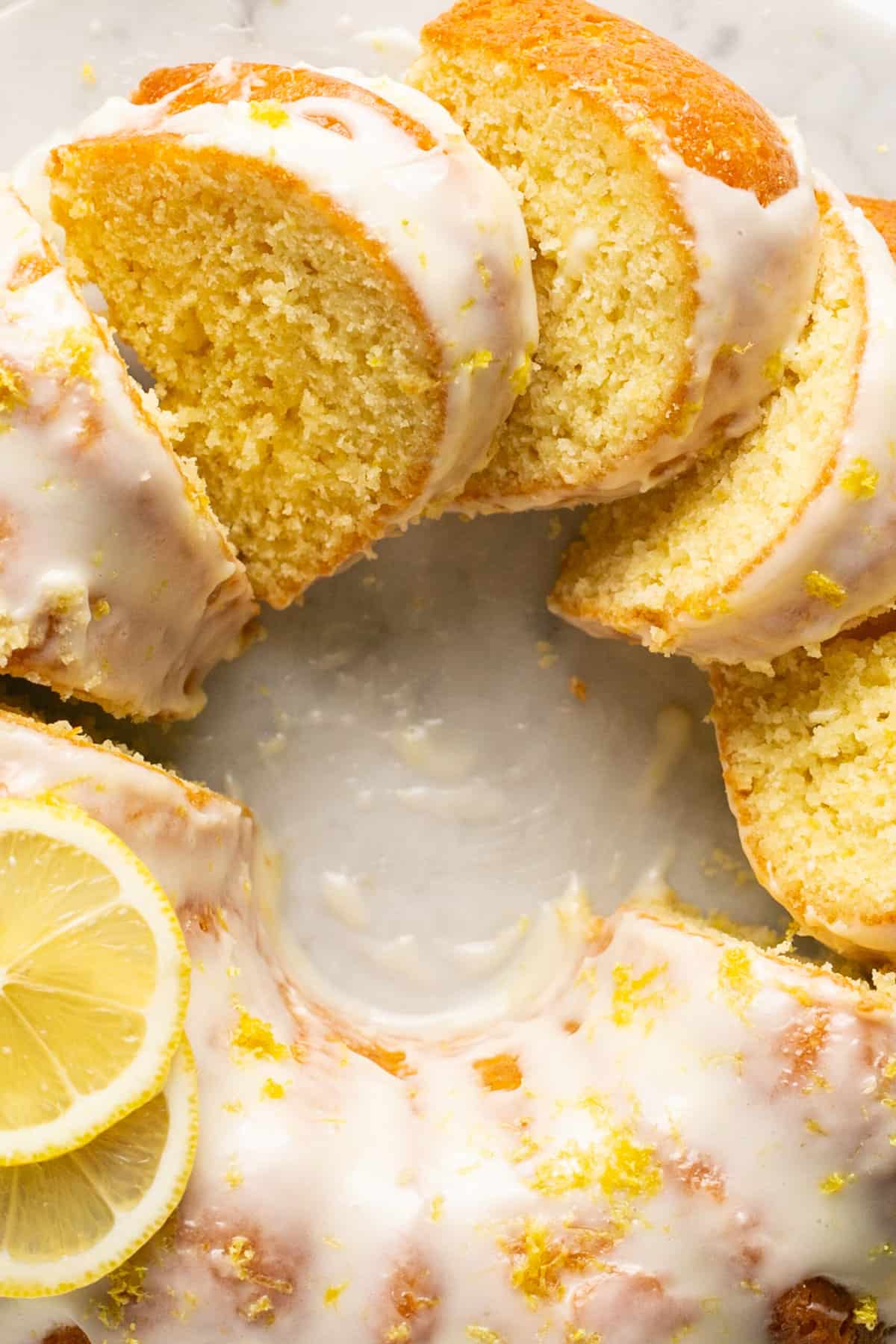overhead view of lemon bundt cake cut into pieces