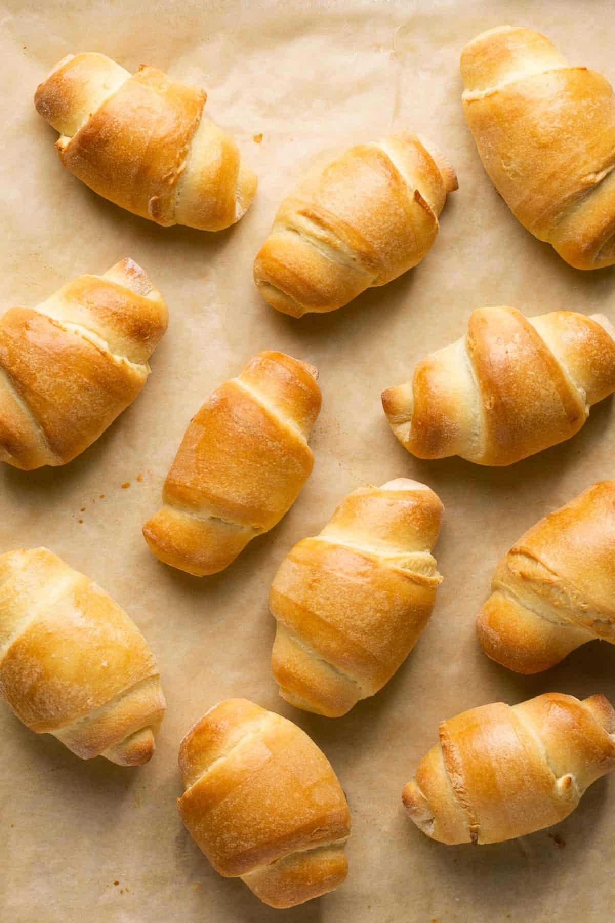 crescent rolls on parchment lined sheet pan