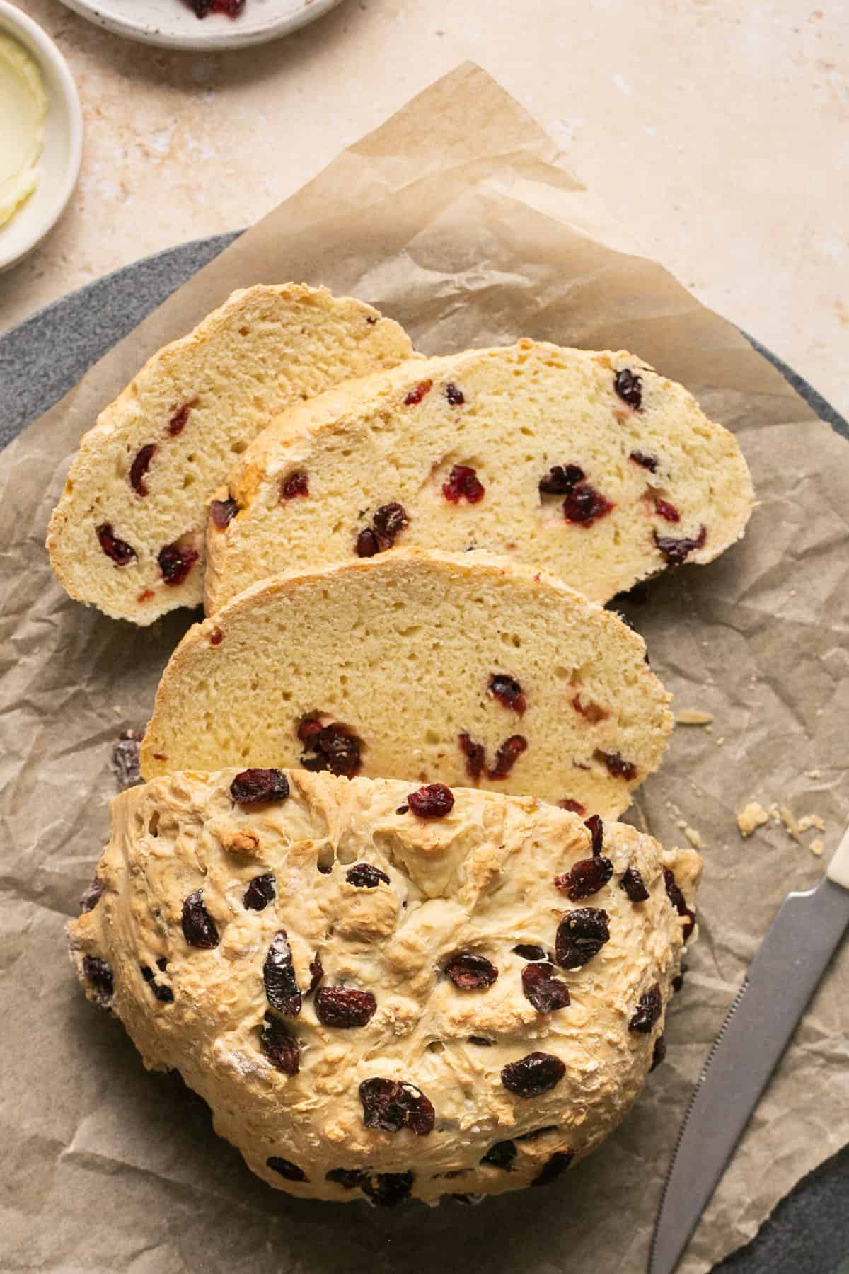 sliced irish soda bread with knife on platter