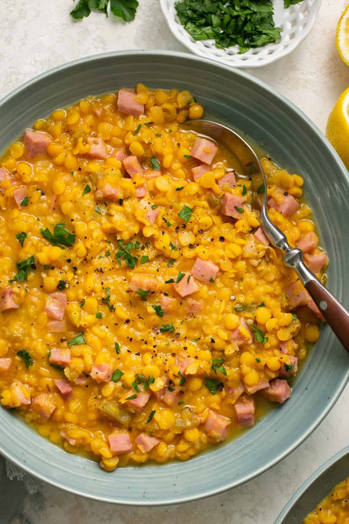 bowl of split pea soup with spoon