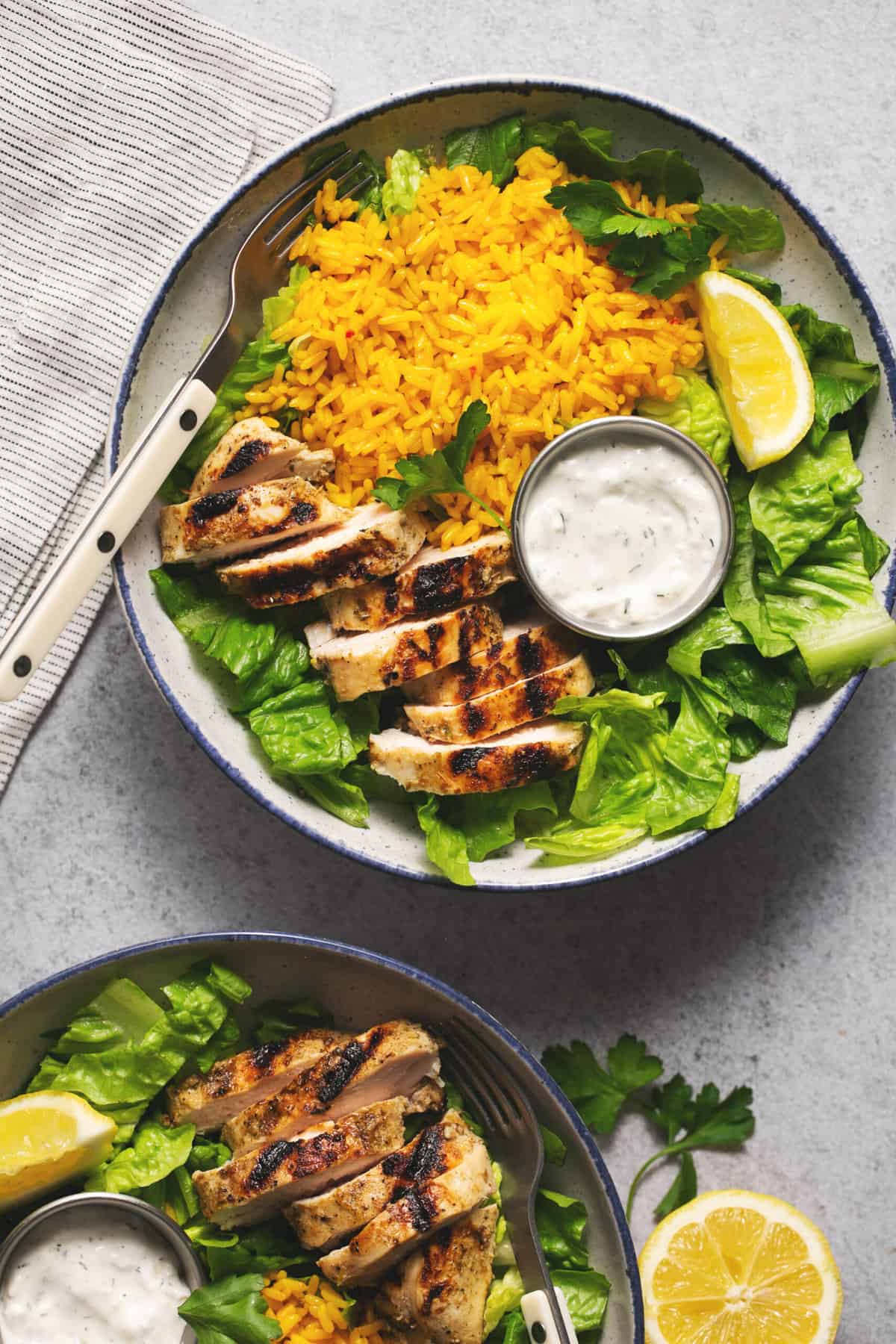 greek chicken bowls with yellow rice and tzatziki sauce
