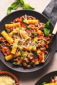 plate of rigatoni bolognese with fork