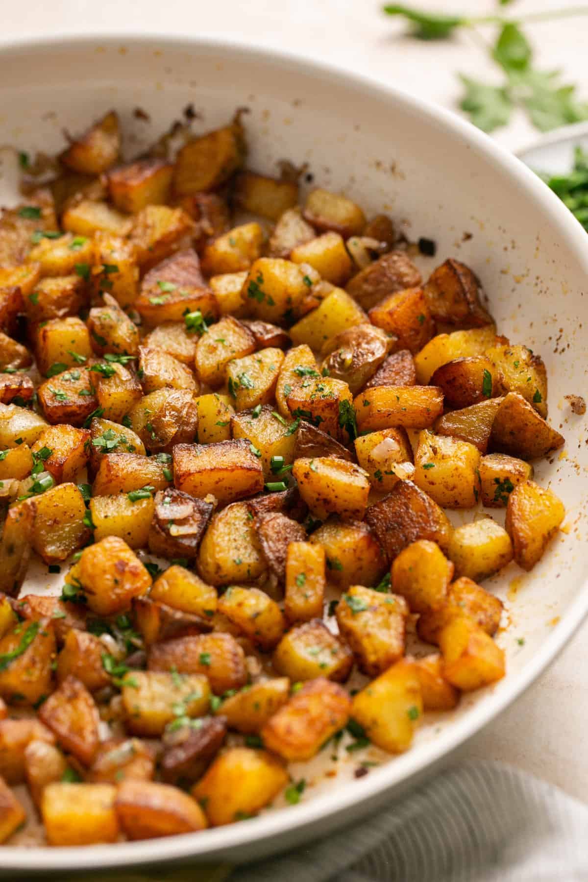 cooked diced potatoes in skillet